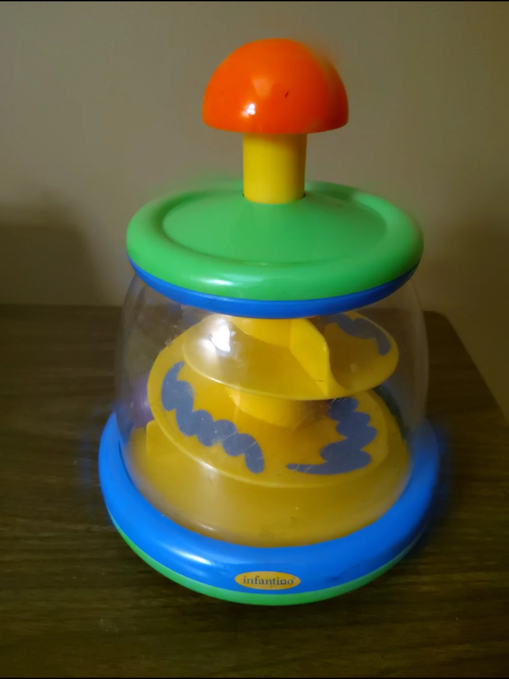Infantino Colorful Spinning Ball Pop Toy - Green, Blue, Yellow, Orange - Vintage